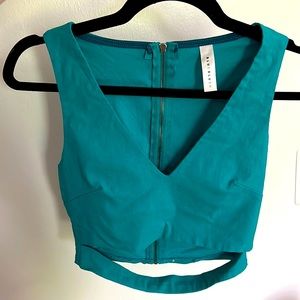 Teal crop top, back zipper. Medium. Worn once. Blue Blush